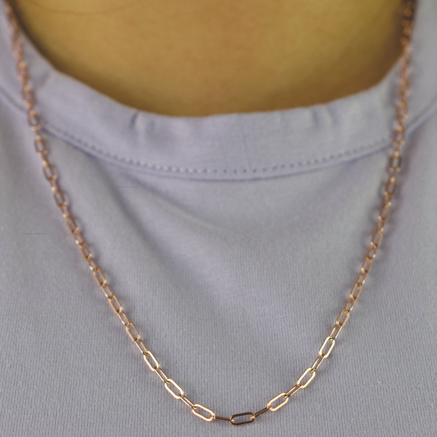 Woman wearing a 14K rose gold fill paperclip chain necklace with dainty style (medium) link size